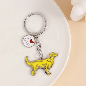 Close-up of metal dog keychain with golden retriever pendant and I Love Dogs charm