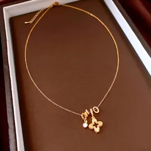 Elegant 18k gold plated four-leaf clover pendant necklace with zircon crystals in jewelry box