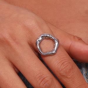 Macro shot of silver organic lava ring showing liquid texture and irregular geometry