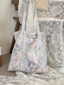 Elegant white floral lace tote bag with shoulder straps and vintage aesthetic details