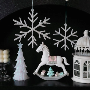 White Christmas decoration set featuring snowflake and rocking horse on black backdrop