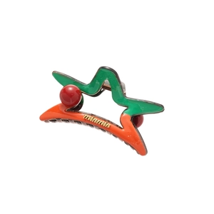 Pince à cheveux en forme d'étoile en acrylique bicolore vert et orange avec texte