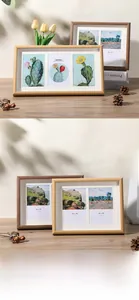 Detail of Nordic wooden photo frames with natural grain and multi-aperture mat inserts