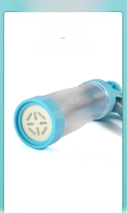 Detail of the blue cookie press gun with secure locking slot and white piping nozzle