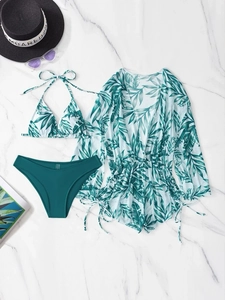 Detailed flat lay of three-piece tropical print swimwear with high-waist bikini set