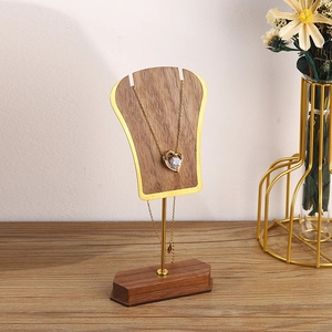 Minimalist walnut wood and gold metal necklace display stand for elegant jewelry storage