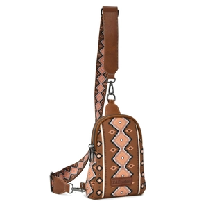 Close-up of bohemian geometric pattern canvas chest bag with brown leather accents