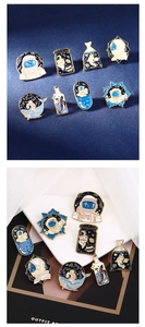 Detailed set of eight astronaut enamel pins with dark blue starry sky theme and gold trim