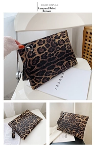 Close-up detail of leopard print envelope clutch bag with wrist strap and zipper closure