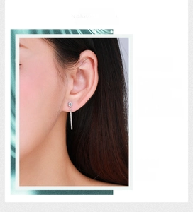 Detail shot of elegant S925 sterling silver tassel drop earrings with sparkling pavé zircons