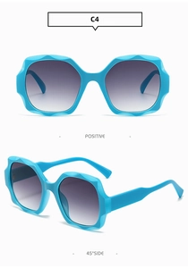 Detail view of blue wavy hexagonal sunglasses frame with purple gradient lenses