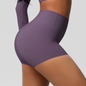 Close-up of high-waist purple yoga shorts showing seamless texture and lifting effect