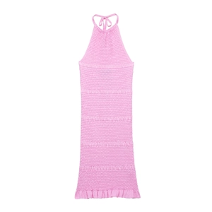 Pink smocked knit halter dress with ruffled hem and drawstring details on white background