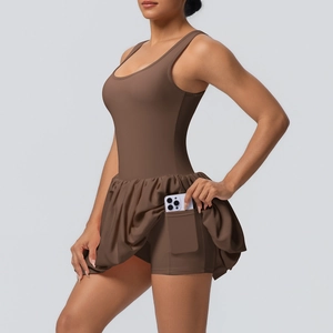 Brown athletic tennis dress with built-in shorts and side phone pocket for sports