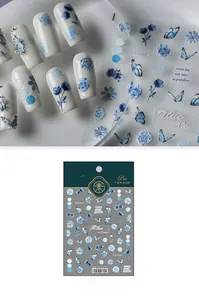 Detailed view of TS-2444 blue floral 5D nail stickers with 3D embossed rose and butterfly designs
