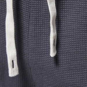 Men's dark gray waffle knit shorts featuring high-quality fabric texture and white drawstring