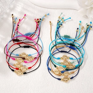 Handmade woven cord bracelets with St. Benedict religious medals in various colors