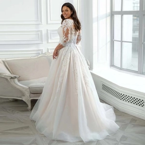 Elegant off-the-shoulder lace bridal gown with long sleeves and high waist tulle train