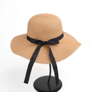 Women's wide brim straw sun hat with black ribbon bow for summer beach sun protection
