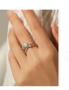 Macro view of crossover line ring with round brilliant cut moissanite on model hand