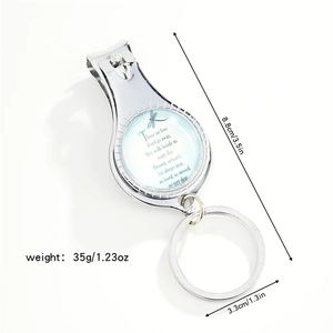 Detail view of dragonfly nail clipper keychain with dimensions and memorial quote