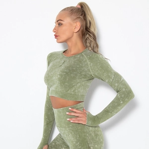 Detail of olive green acid wash yoga set featuring ribbed waistband and seamless knit fabric