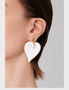 Macro detail of elegant white calla lily flower earrings in 18k gold plated copper finish