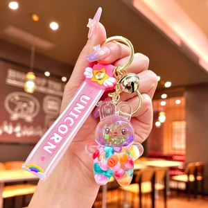 Cute bunny liquid quicksand keychain with pink wristband and colorful glitters