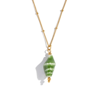 Detail of green conch pendant on a gold bead chain necklace with polished finish