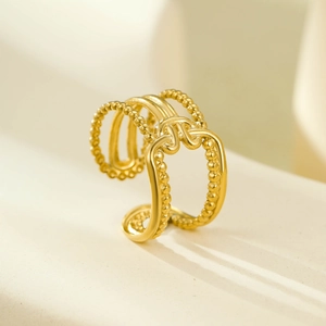 Detail of 18K gold-plated stainless steel multi-layer hollow ring with beaded textures