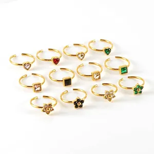 Set de 12 anillos ajustables de acero inoxidable en oro de 18k con circonitas de colores
