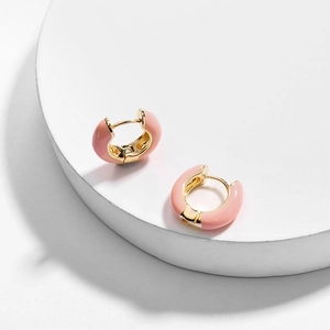 Detailed view of pink enamel and gold-plated geometric round hoop earrings