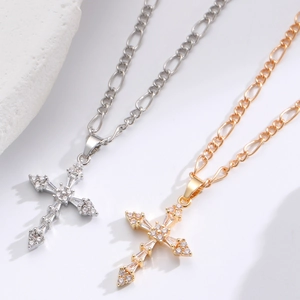 Cross pendant necklaces with cubic zirconia in gold and silver finishes on Figaro chains