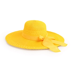 Close-up of woven straw texture and yellow satin bow on a wide-brimmed sun hat