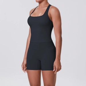 Detail view of high-waist black sports shorts with functional side pocket for phone
