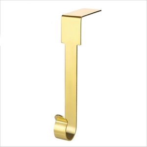 Close-up of a sturdy golden metal J-hook for fireplace mantle Christmas stocking support