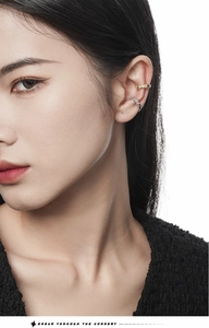 Detail of elegant S925 silver ear cuffs featuring colorful zircon and sparkling diamonds
