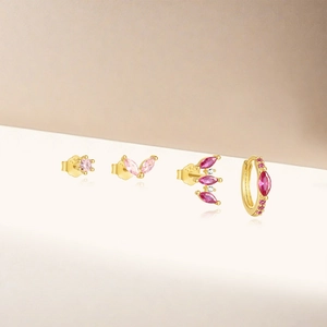 Detail of S925 silver earring set with marquise pink crystals and gold-plated finish