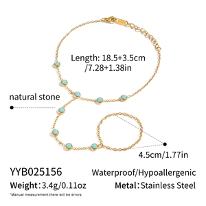 Detail of 18K gold-plated stainless steel hand chain bracelet with blue turquoise stones