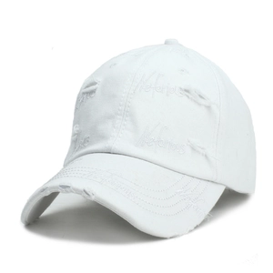 Close-up of embroidered Nefarious text on distressed cotton baseball cap with torn details