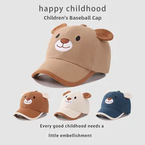 Detailed view of cartoon bear embroidery and 3D ears on cotton kids baseball caps