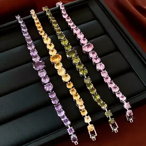 Fashion zircon tennis bracelets in purple, yellow, green and pink on black leather tray