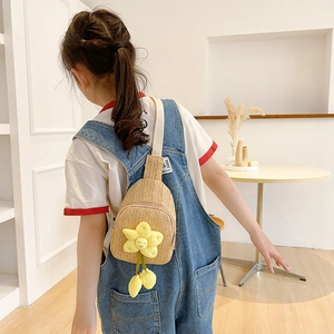 Handwoven straw crossbody bag for girls with cute yellow sunflower charm for summer