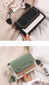 Detail of color-block crossbody bag with wide jacquard strap and textured leather finish