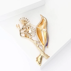 Detailed view of the brooch back showing the secure gold metal pin clasp mechanism