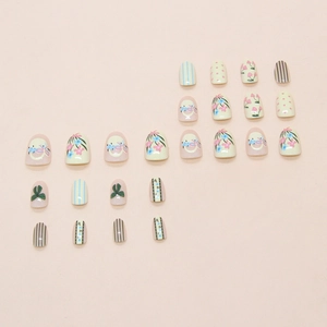 Pastel floral press on nails with bow designs and stripes in pink yellow and blue