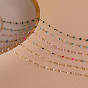 Bohemian style colorful enamel bead chains in multi-color options on a decorative plate