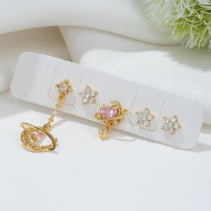 5-piece gold earrings set with pink and white zircon stars and moons on white display