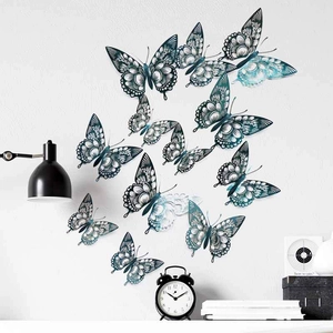 Macro detail of 3D cutout butterflies with metallic blue gradient on a white wall