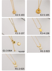Selection of gold-plated titanium steel necklaces with diverse pendants and double-sided designs